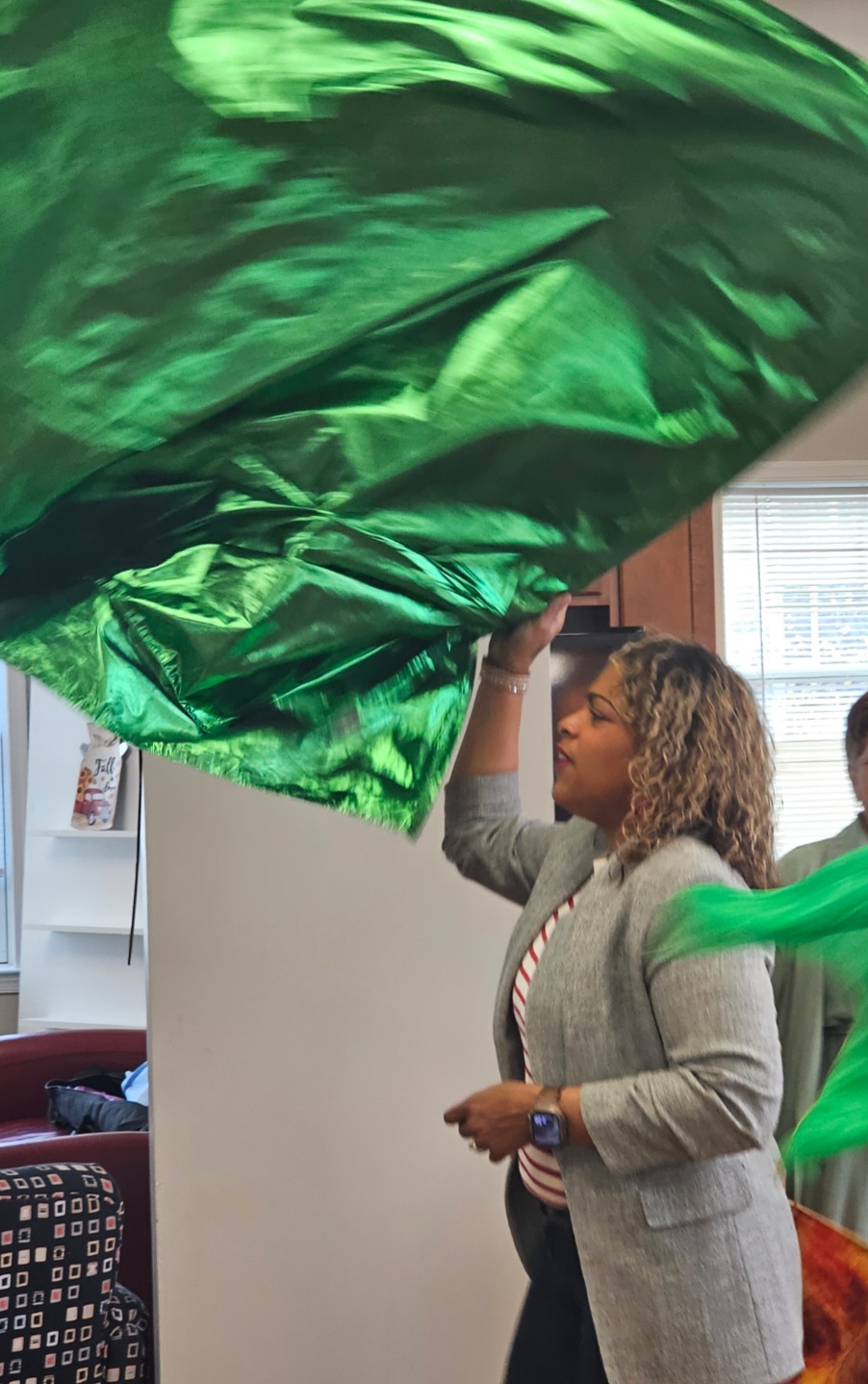 Instructor demonstrating with a green flag during a workshop