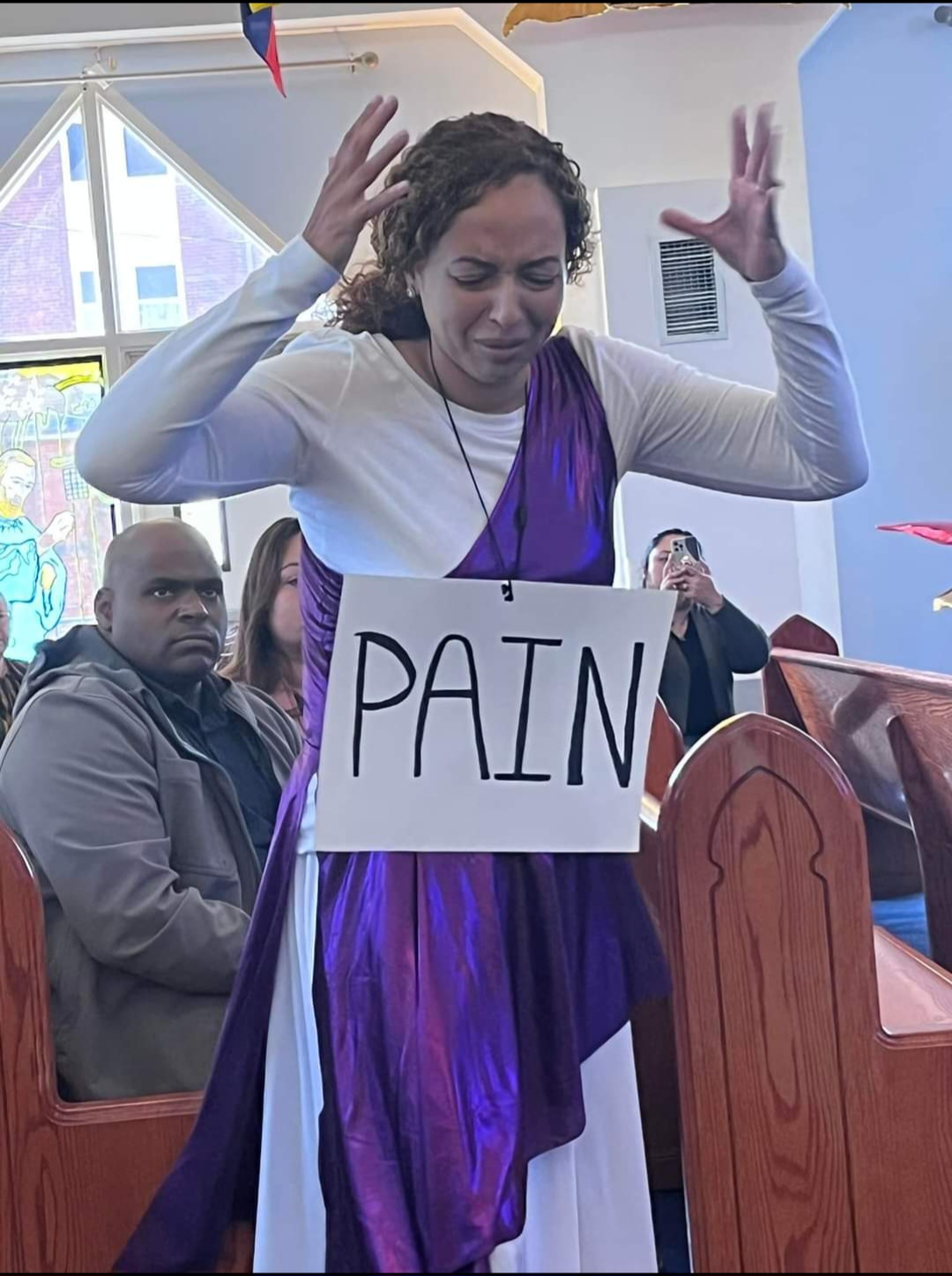 Worshipper ministering through praise drama during a church gathering
