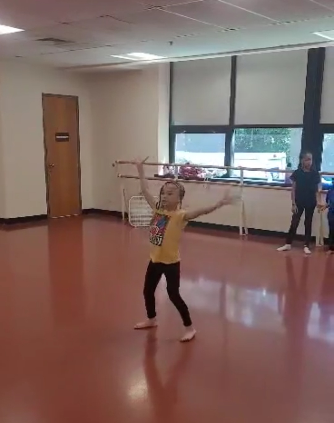 Young student practicing worship dance in the studio during class