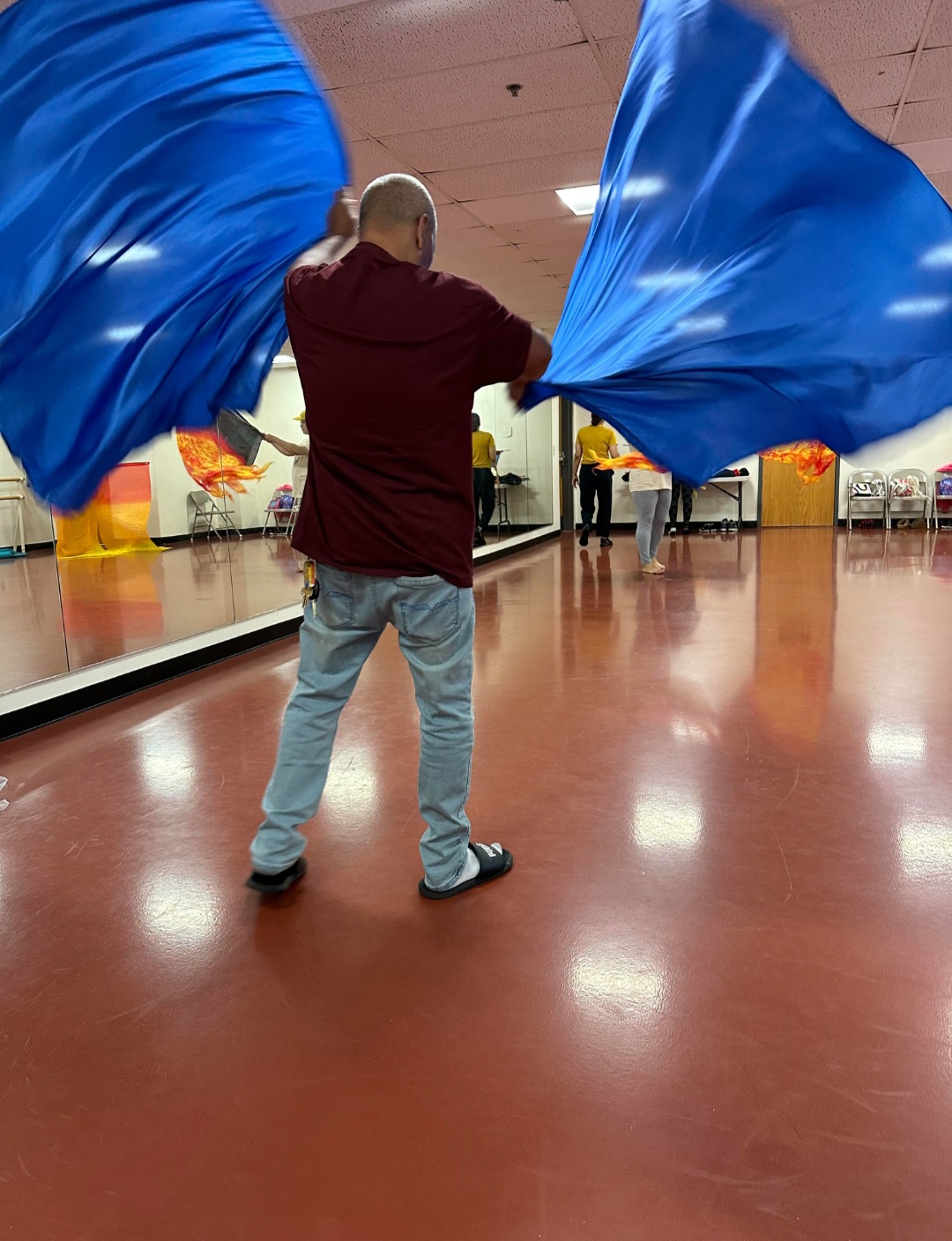 Student training with blue flags in the studio