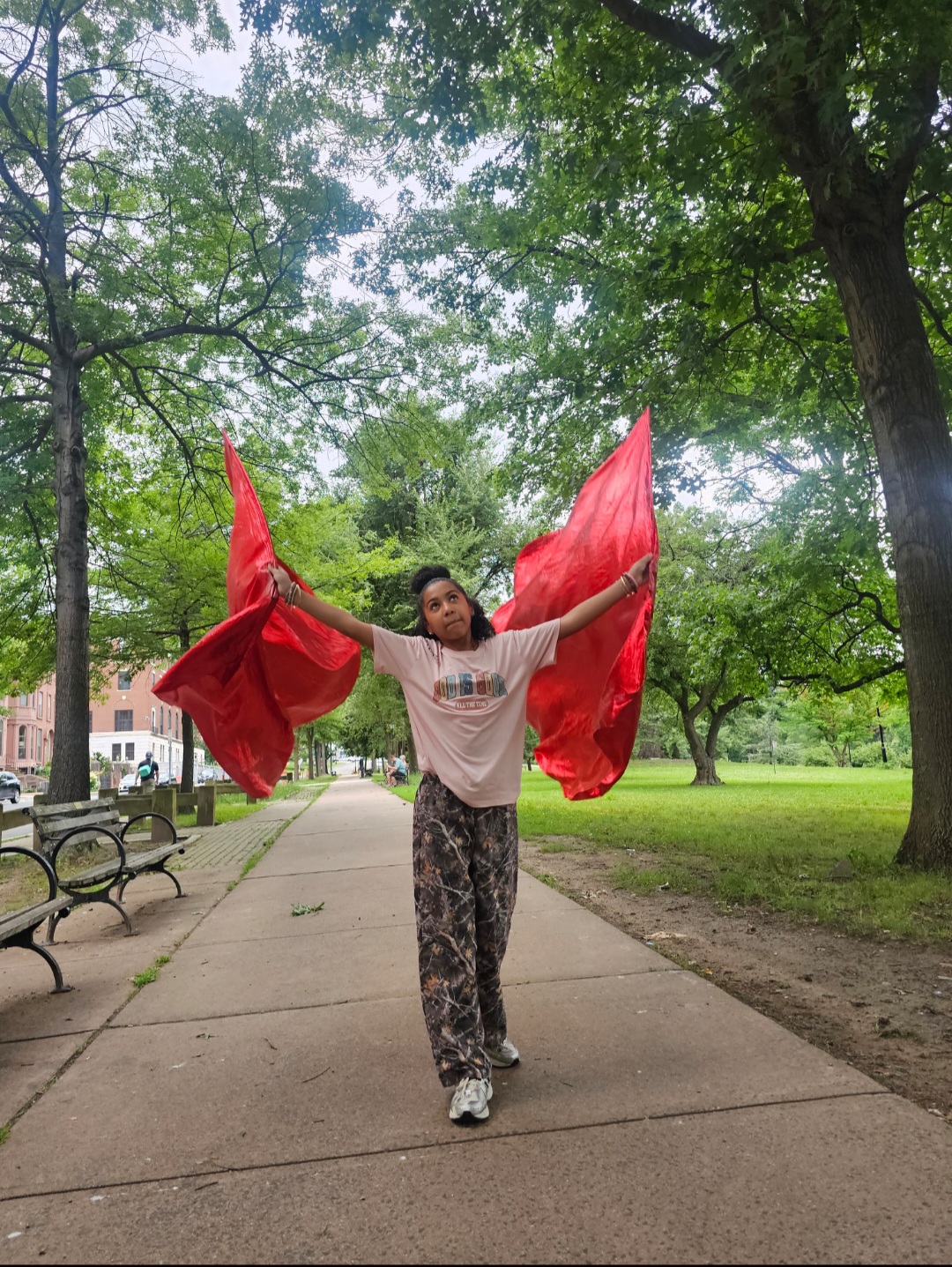 Sanai Edward, Youth Choreography Instructor — flagging in worship with red flags